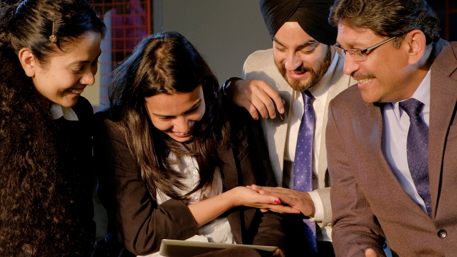 A closeup shot of a group of Indian colleagues in the office